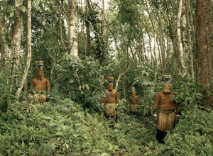 Guardians-of-the-Forest-Deep-in-the-Colombian-Amazon-Yucuna-indians-stand-dressed-in-traditional-tribal-attire-for-the-Baile-del-Mu  Eco-or-puppet-dance-a-celebration-of-the-abundance-of-the-Chontaduro-fruit.-While-traditiona